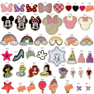 May include: A collection of assorted embroidered and sequined patches featuring various character shapes, rainbows, stars, hearts, and castle designs. Each patch is labeled with a code from D1 to D45, with some items marked as sold out.