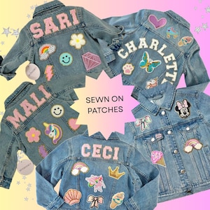 May include: Four blue denim jackets decorated with colorful embroidered patches and personalized names in large letters. The patches include rainbows, unicorns, flowers, hearts, crowns, and ice cream cones. Text in the center reads SEWN ON PATCHES.