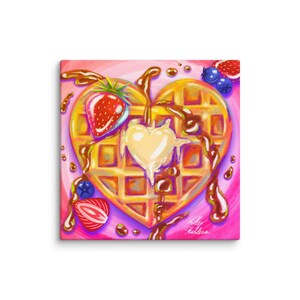May include: A heart-shaped waffle with a yellow center, topped with a red strawberry, blueberries, and chocolate syrup on a pink background.