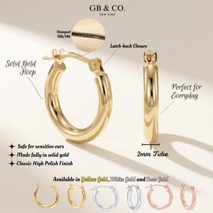May include: A pair of solid gold hoop earrings with a high polish finish and a latch-back closure. The hoops feature a 2mm tube thickness. A circular inset shows a 10k/14k stamp. Additional color options include yellow, white, and rose gold.