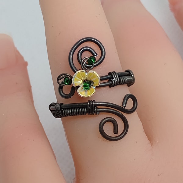 Handcrafted rugged iron wire decorated ring, with tiny 3 petalled acrylic flower, AB coated, giving beautiful glistening shine.