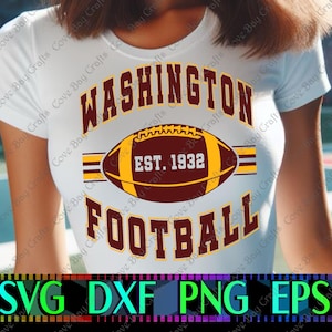 May include: White t-shirt with a maroon and gold design. The design features the words "WASHINGTON FOOTBALL" and a football graphic with "EST. 1932". The bottom of the image has the words "SVG DXF PNG EPS".