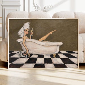 May include: A framed wall art print featuring an oil painting of a person with a white towel wrapped around their head, relaxing in a white clawfoot bathtub. The person holds a glass of champagne and a Vogue magazine. The floor has a black and white checkerboard pattern, and the background is a solid olive green color.