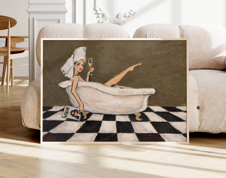 May include: A framed wall art print featuring an oil painting of a person with a white towel wrapped around their head, relaxing in a white clawfoot bathtub. The person holds a glass of champagne and a Vogue magazine. The floor has a black and white checkerboard pattern, and the background is a solid olive green color.