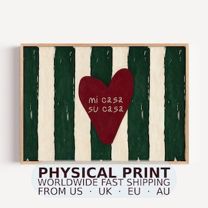 May include: A rectangular wall art print featuring a dark green and cream vertical striped background. Centered on the stripes is a large, solid dark red heart shape with the white text "mi casa su casa" written in the middle of the heart.