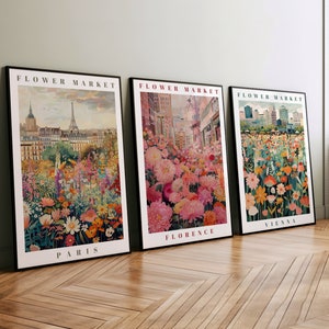 Puede incluir: Tres impresiones enmarcadas con el título "Flower Market" y los nombres de las ciudades París, Florencia y Viena. Cada impresión presenta una ilustración colorida de un mercado de flores en la ciudad respectiva.