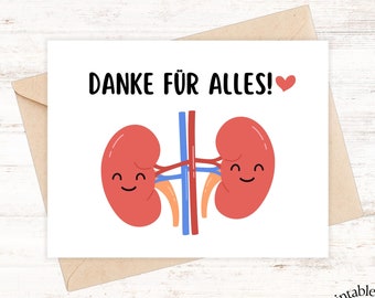 Könnte beinhalten: Eine weiße Karte mit dem Text "DANKE FÜR ALLES!" und einem roten Herz. Die Karte zeigt eine Cartoon-Illustration von zwei lächelnden Nieren mit blauen und orangefarbenen Venen. Die Karte befindet sich in einem braunen Umschlag.