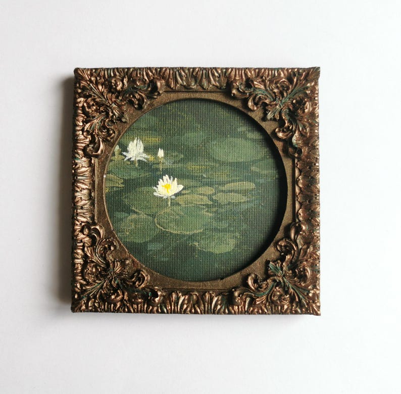 Small lotus flower painting inspired by nature and still water, framed in aged bronze style.