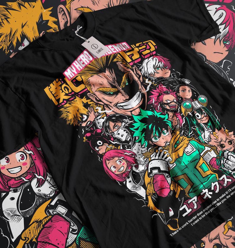 May include: Black t-shirt with a graphic print of characters from the anime My Hero Academia. The characters are in various poses and expressions, with the text "MY HERO ACADEMIA" and "ユアネクス" in Japanese. The text below the characters reads "I have to work harder than anyone else to make it. I'll never want to be like you... I look up to you... the strong."