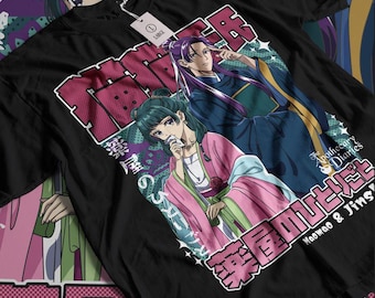 May include: Black t-shirt with a graphic print of two anime characters. The characters are a woman with long green hair and a man with long purple hair. The text on the shirt reads "The Apothecary Diaries" and "Maomao & Jins".