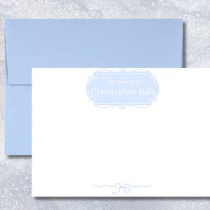 From-the-nursery flat note cards personalized with name in white within a pink or blue frame. Sets of 10 include coordinating envelopes.