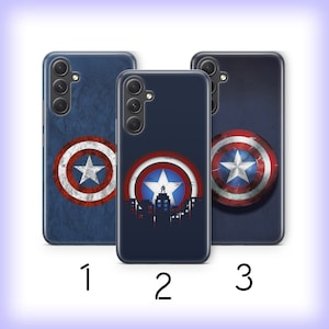 May include: Three phone cases with a blue background and a red, white, and blue Captain America shield design. The shield design is centered on the first and third cases, while the second case features a cityscape silhouette with the shield in the background.