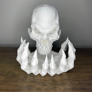 Decorative Sculpture of White Skull with Skeleton Hands - Gothic and Modern Art