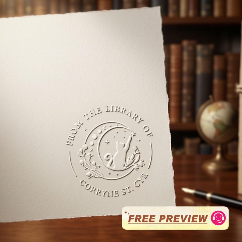 May include: Cream-colored paper with an embossed circular design featuring a cat reaching for a star within a crescent moon. The text reads "FROM THE LIBRARY OF CORRYNE ST. CYR." A "FREE PREVIEW" sticker is at the bottom.