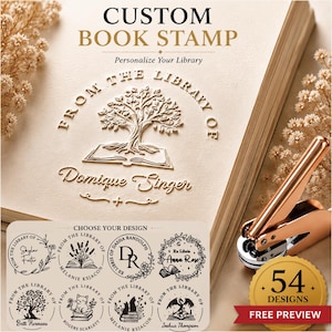 May include: A custom book embosser with a rose gold finish, shown creating a raised tree and open book design on paper. The text reads CUSTOM BOOK STAMP, Personalize Your Library, and FROM THE LIBRARY OF Domique Singer. Includes 54 design options.