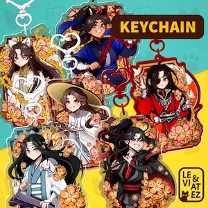 Pode incluir: Uma coleção de chaveiros de acrílico coloridos com personagens em estilo anime. Cada chaveiro apresenta um design de personagem diferente, rodeado por detalhes florais e em forma de coração. A palavra "KEYCHAIN" é exibida em uma faixa amarela.