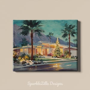 May include: A rectangular canvas print featuring a painting of a mid-century modern house at night, illuminated by warm string lights and a glowing Christmas tree. Tall palm trees frame the structure, with mountains in the background.