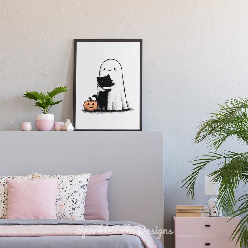 Cozy ghost and black cat wall decor with pumpkin in bedroom setting.