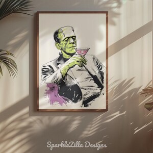 Frankenstein sipping a pink martini wall art print displayed in modern home interior with plants, retro Halloween digital download.
