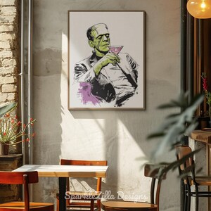 Frankenstein martini cocktail printable wall art displayed on yellow sofa background, retro Halloween bar cart art.
