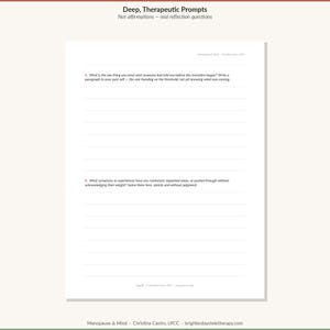 May include: A white paper sheet titled Deep, Therapeutic Prompts with the subtitle Not affirmations &mdash; real reflection questions. It contains two numbered writing prompts about life transitions and personal experiences, with lined spaces for written responses.