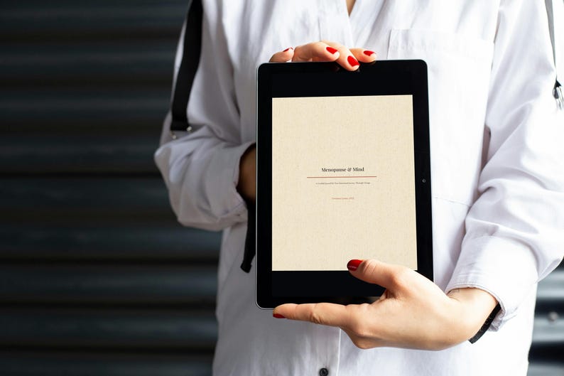 May include: A black tablet displaying a cream-colored screen with the text "Metaphysics of Mind" centered in a dark serif font. The screen also includes smaller sub-text below the title, presenting a clean, digital interface for reading.