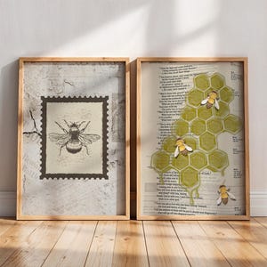 May include: Two framed art prints with a bee theme. One features a vintage postage stamp design with a detailed bee illustration. The other showcases a honeycomb with bees, set against a backdrop of aged paper.
