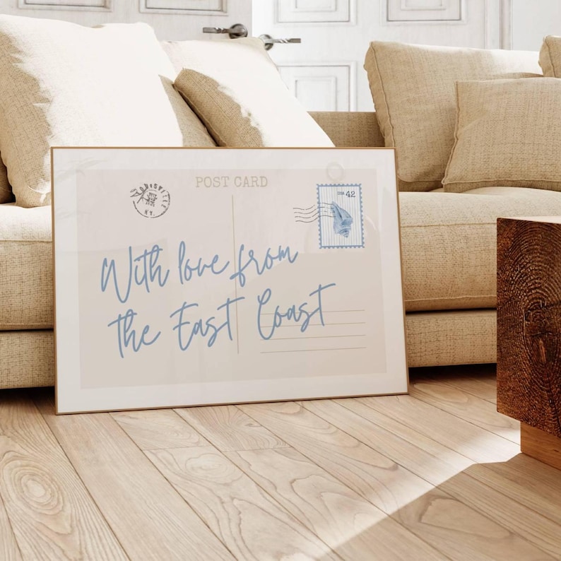 with love from the east coast print in blue script typography with striped vintage seashell stamp on horizontal postcard
