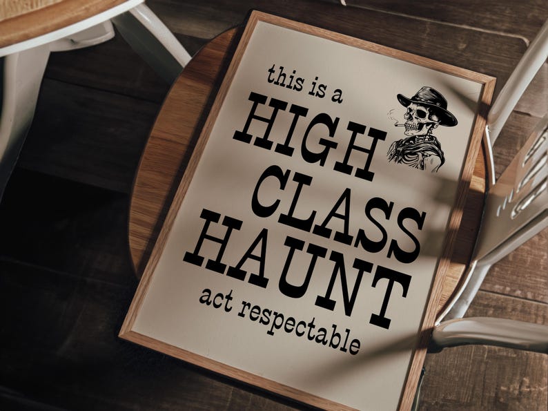 May include: A framed sign with the text "this is a HIGH CLASS HAUNT act respectable" and a black and white illustration of a skeleton wearing a cowboy hat and smoking a pipe.