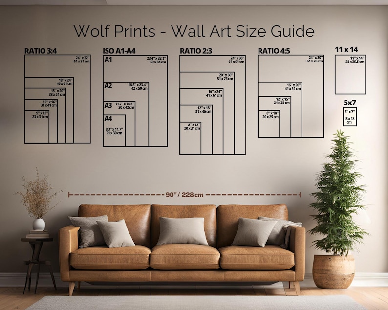 May include: A wall art size guide titled "Wolf Prints" displays various print sizes in inches and centimeters, including ratios 3:4, 2:3, 4:5, and ISO A1-A4. A brown leather sofa with pillows and a potted Christmas tree are in the foreground.