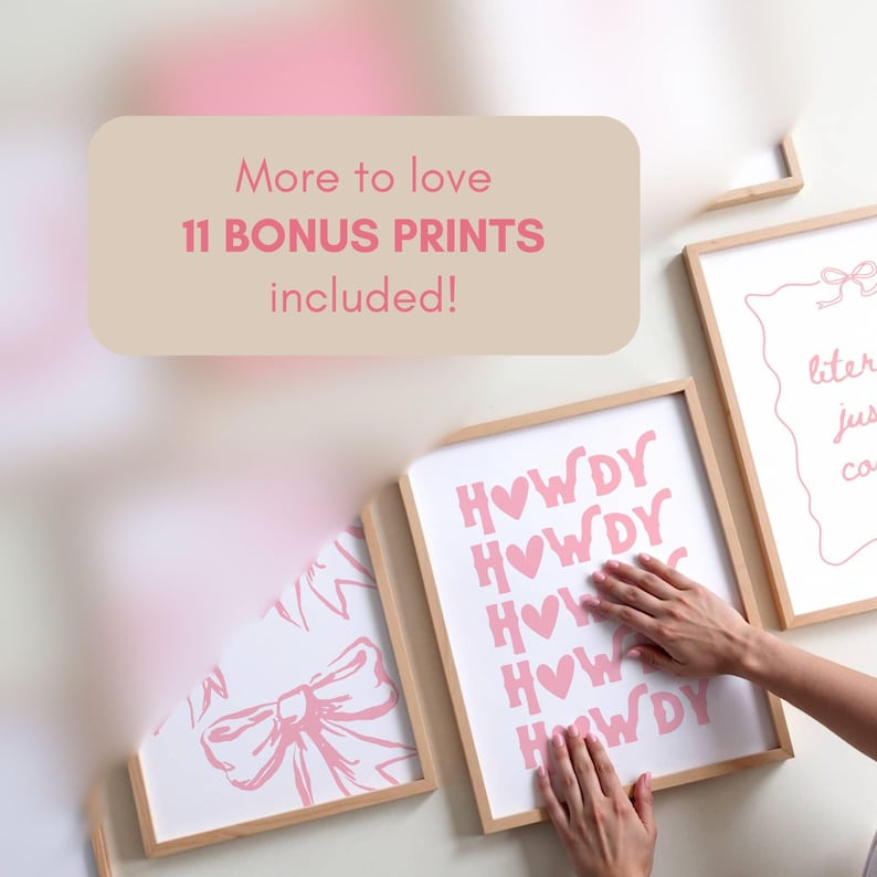 May include: Several framed art prints with a light wood frame are displayed. One print says "HOWDY" in pink letters with hearts. Another print has a bow design. The text "More to love 11 BONUS PRINTS included!" is in the upper left.