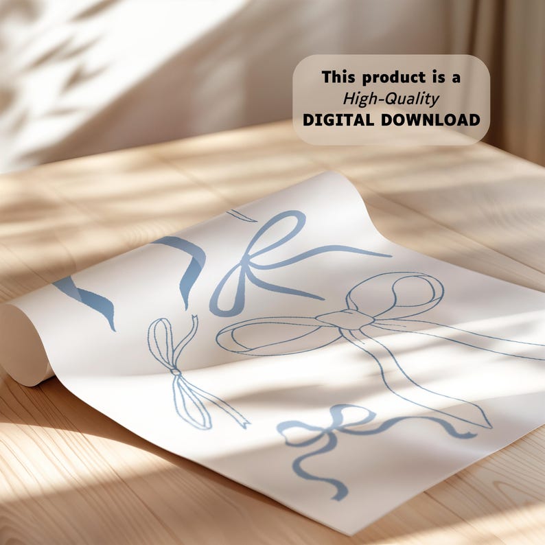 May include: A rolled-up sheet of paper featuring a pattern of light blue ribbon illustrations. The text "This product is a High-Quality DIGITAL DOWNLOAD" is displayed on the top right corner. The paper is resting on a wooden surface.