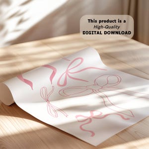 May include: A rolled-up sheet of paper featuring a pattern of pink bows in various sizes and styles. The text on the image reads: "This product is a High-Quality DIGITAL DOWNLOAD."