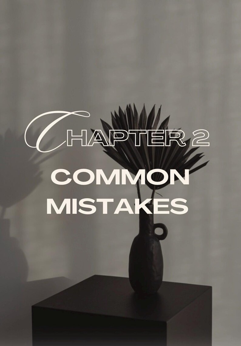 May include: A black vase with a dark palm frond arrangement sits on a black table. The text "CHAPTER 2 COMMON MISTAKES" is overlaid in white, with a stylized font for "CHAPTER 2". The background is a neutral gray.