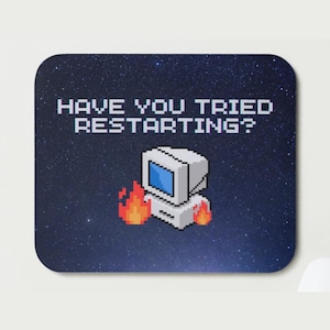 May include: A square coaster with rounded corners featuring a pixelated computer on fire. The background is a starry night sky. The text "HAVE YOU TRIED RESTARTING?" is displayed in white.