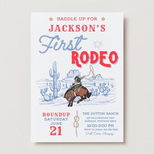 May include: A white invitation with the text "Saddle Up For Jackson's First Rodeo." The design features a cowboy on a bucking bronco, cacti, and a desert landscape. The date is June 21.