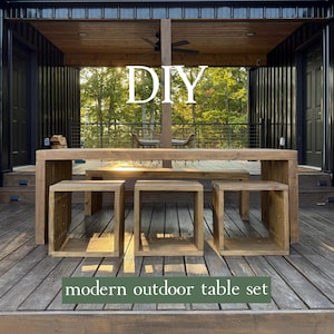 May include: A modern outdoor table set made of light brown wood. The set includes a rectangular table and three cube-shaped stools. The word "DIY" is displayed in white text above the table. The set is on a wooden deck.