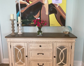 A distressed buffet or server in the dining room