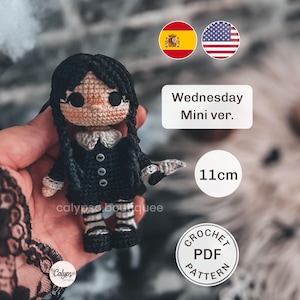 May include: A small crochet doll measuring 11cm in height, featuring black hair in two braids, a black dress with a white collar, and black and white striped stockings. The text "Wednesday Mini ver." and "CROCHET PDF PATTERN" is visible.