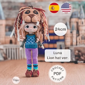 May include: A crochet doll named Luna wearing a lion hat, a blue patterned sweater, purple pants, and brown shoes. The doll stands 24cm tall. The image includes text stating Luna Lion hat ver. and Crochet PDF Pattern, along with Spanish and American flags.
