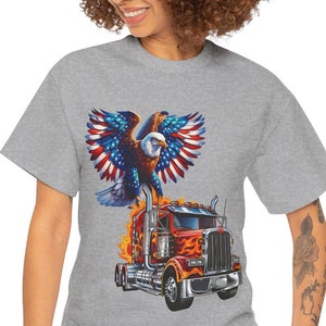 May include: A white ceramic mug with a black handle and the text "But First, Coffee" in a bold, black font. The mug is set against a blurred background, suggesting a cozy setting.