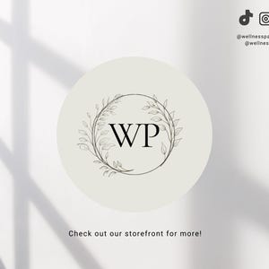 May include: A white circle with a black floral wreath and the letters "WP" in the center. The text "Check out our storefront for more!" is below the circle.