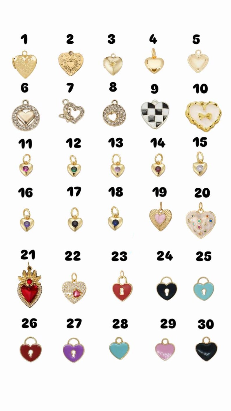 May include: A selection of 30 heart-shaped charms in gold, silver, and enamel. Designs include lockets, gemstones, and patterned surfaces. Each charm has a loop for attaching to jewellery.