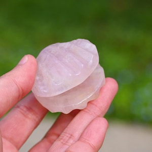 May include: A set of three ceramic mugs with a speckled, matte finish. The mugs are in shades of cream, light gray, and dark gray. Each mug has a simple, minimalist design and a rounded handle.