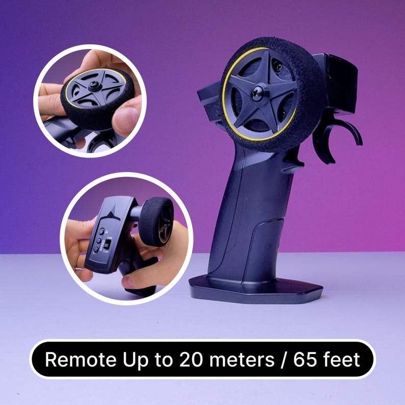 May include: Black remote control with a yellow rimmed wheel and a black and yellow wheel on the side. The remote control has a black handle and a black base. The text "Remote Up to 20 meters / 65 feet" is displayed below the remote control.