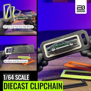 May include: A 1/64 scale diecast clipchain display frame for Hot Wheels blister packs. The black rectangular frame features a central cutout to hold a green toy car in its plastic packaging. The frame includes the BB Projects logo and text.