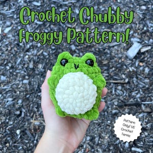May include: A plush, round, green crochet frog with a white belly, black plastic eyes, and a small stitched mouth. The text "Crochet Chubby Froggy Pattern!" appears at the top, and a white badge reads "Pattern Only! US Crochet Terms".