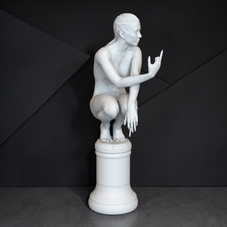 Rebellious Thinker statue featuring a nude feminine figure crouched on a round pedestal, holding a cigarette and making a bold hand gesture, with a calm, defiant expression and contemporary art styling.
