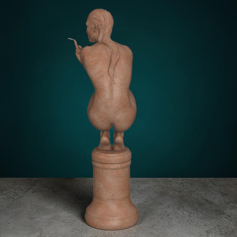 Rebellious Thinker statue featuring a nude feminine figure crouched on a round pedestal, holding a cigarette and making a bold hand gesture, with a calm, defiant expression and contemporary art styling.
