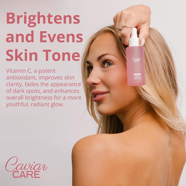 May include: A clear glass bottle with a pink label that says "Caviar Care" and a dropper. The bottle is being held by a person with a light pink background. The text "Brightens and Evens Skin Tone" is in large pink letters at the top of the image. The text "Vitamin C, a potent antioxidant, improves skin clarity, fades the appearance of dark spots, and enhances overall brightness for a more youthful, radiant glow." is in smaller pink letters below the bottle. The text "Caviar CARE" is in pink letters at the bottom of the image.